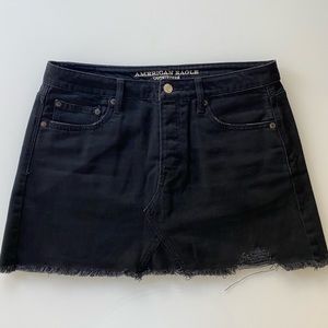 Distressed black denim mini skirt